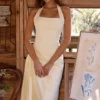 Bawełniana sukienka midi Tallulah z dekoltem halter w kolorze cytrynowym Bawełniana sukienka midi Tallulah z dekoltem halter w kolorze cytrynowym
