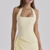 Bawełniana sukienka midi Tallulah z dekoltem halter w kolorze cytrynowym Bawełniana sukienka midi Tallulah z dekoltem halter w kolorze cytrynowym