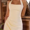 Bawełniana sukienka midi Tallulah z dekoltem halter w kolorze cytrynowym Bawełniana sukienka midi Tallulah z dekoltem halter w kolorze cytrynowym