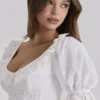 Biała sukienka midi Bella z angielską haftowaną koronką Biała sukienka midi Bella z angielską haftowaną koronką
