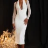 Biała sukienka midi z głębokim dekoltem Yasmin Biała sukienka midi z głębokim dekoltem Yasmin