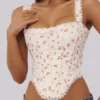 Biały top z bawełny z nadrukiem róż i falbaną Adina Biały top z bawełny z nadrukiem róż i falbaną Adina