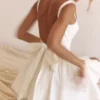 Mini sukienka Florianne z bawełnianą kokardką w kolorze kości słoniowej Mini sukienka Florianne z bawełnianą kokardką w kolorze kości słoniowej