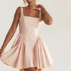 Mini sukienka Florianne z miękką brzoskwiniową kokardką Mini sukienka Florianne z miękką brzoskwiniową kokardką