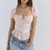 Różowa bluzka z falbaną Cara Peplum Top Różowa bluzka z falbaną Cara Peplum Top