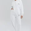 Biała bluza z kapturem z bawełnianym polarem w środku i zamkiem na całej długości Biała bluza z kapturem z bawełnianym polarem w środku i zamkiem na całej długości