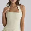 Tallulah – bawełniana sukienka midi w kolorze matcha z dekoltem halter Tallulah – bawełniana sukienka midi w kolorze matcha z dekoltem halter